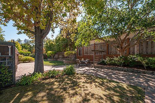 335 Warren Road San Mateo, CA 94402 - Photo 3 of 21 a pathway of a house with a yard