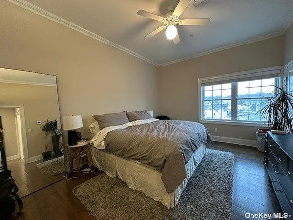 a bed sitting in a room next to a window
