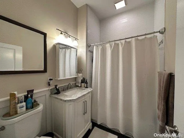 a bathroom with a double vanity sink and mirror