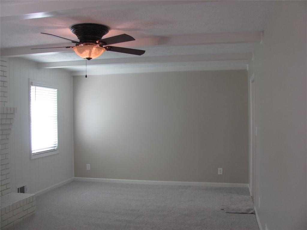 3415 Macland Road Powder Springs, GA 30127 - Photo 11 of 20 an empty room with a chandelier fan