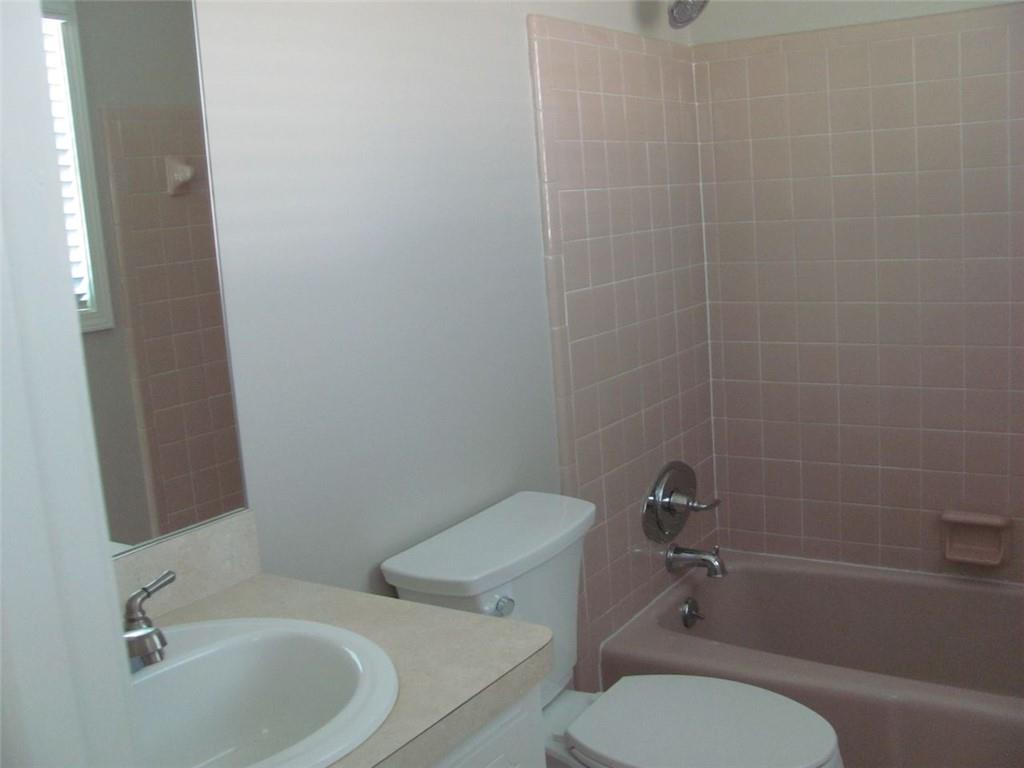 3415 Macland Road Powder Springs, GA 30127 - Photo 13 of 20 a white toilet sitting next to a bath tub
