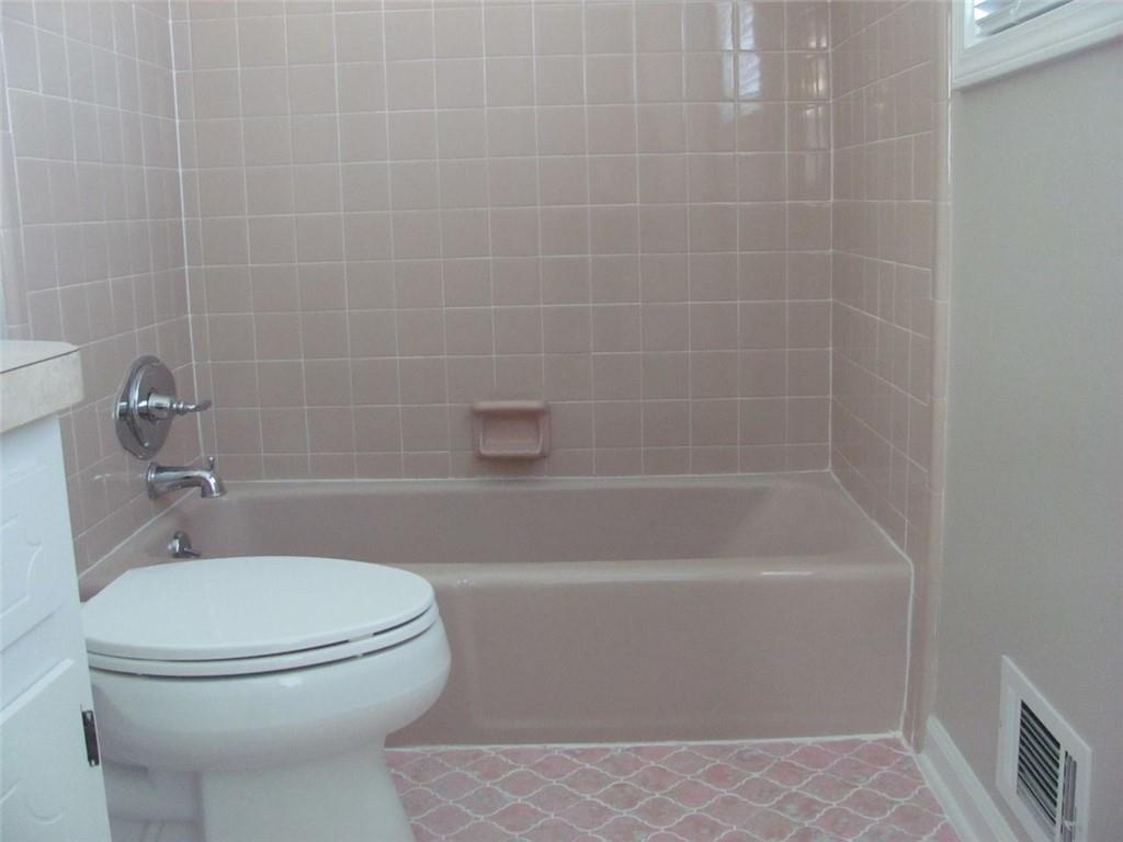 3415 Macland Road Powder Springs, GA 30127 - Photo 16 of 20 a white toilet sitting next to a bath tub