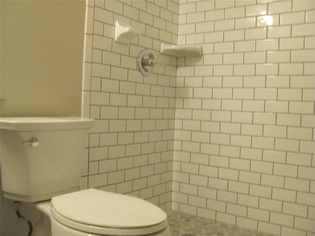 3415 Macland Road Powder Springs, GA 30127 - Photo 20 of 20 a white toilet sitting next to a white wall