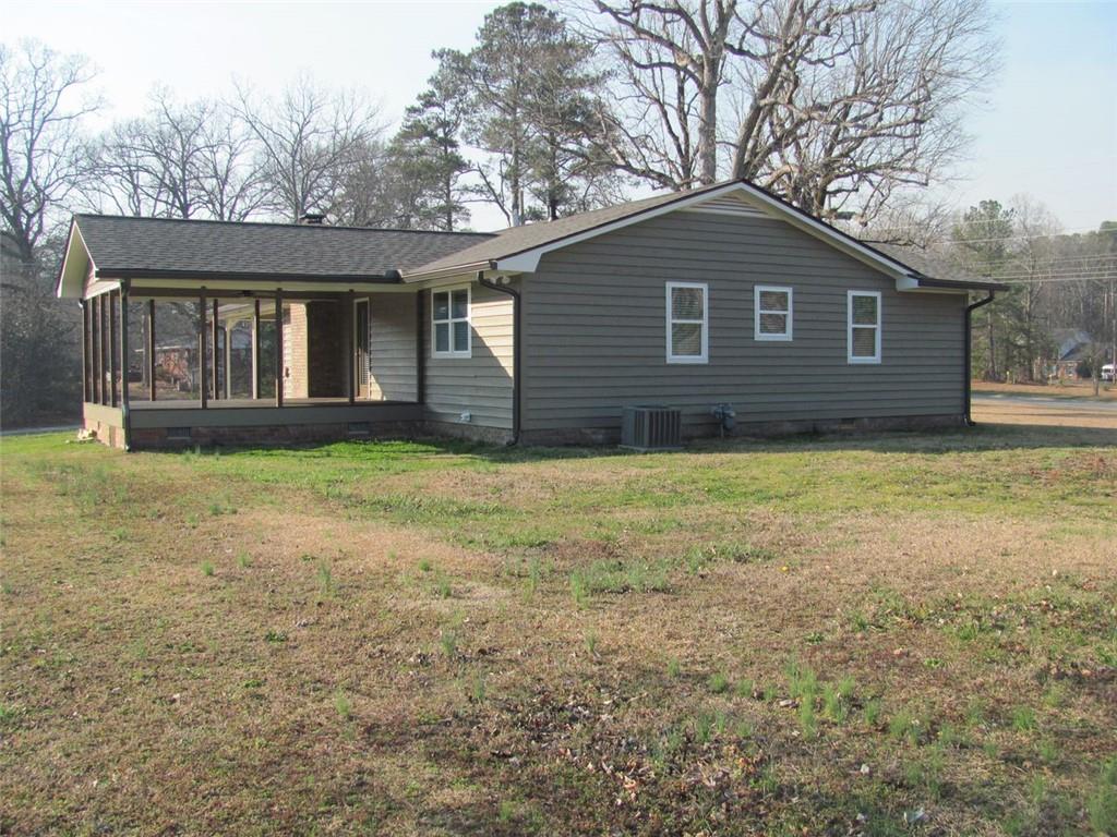3415 Macland Road Powder Springs, GA 30127 - Photo 4 of 20 a view of a house with yard and a garden
