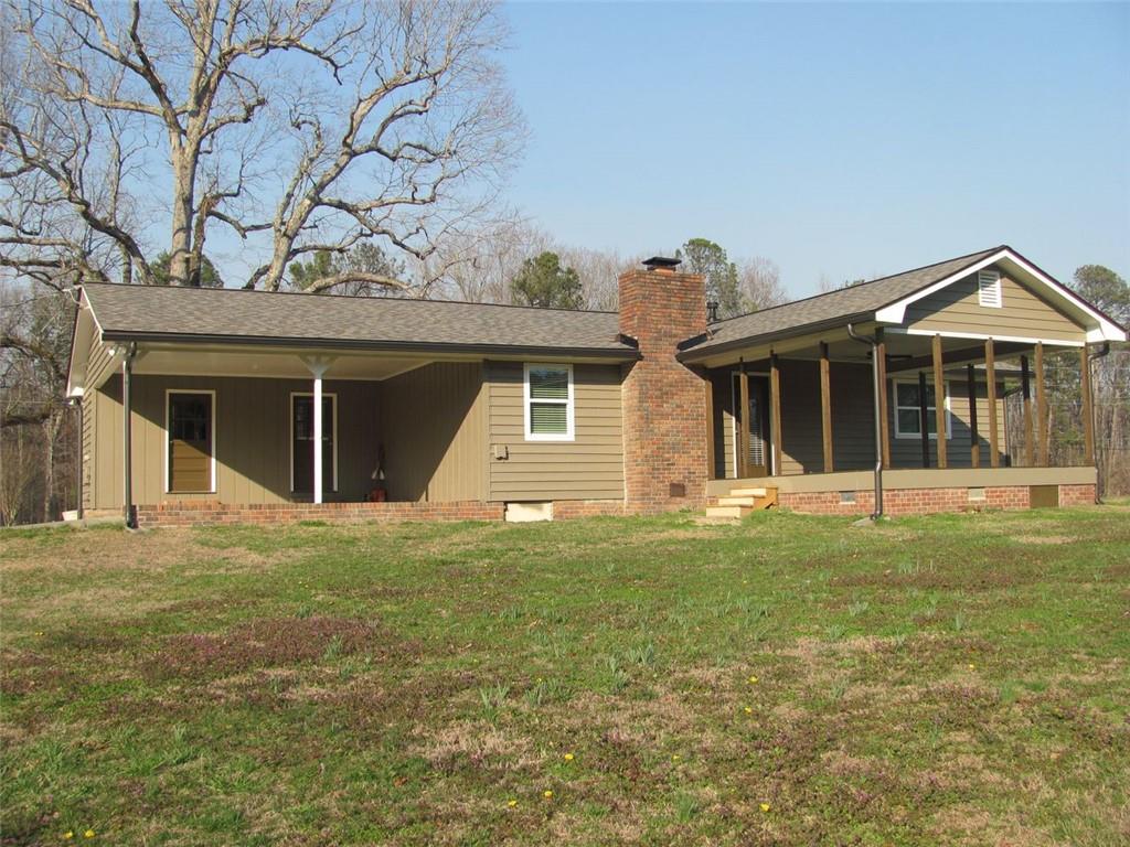 3415 Macland Road Powder Springs, GA 30127 - Photo 6 of 20 a front view of a house with a garden