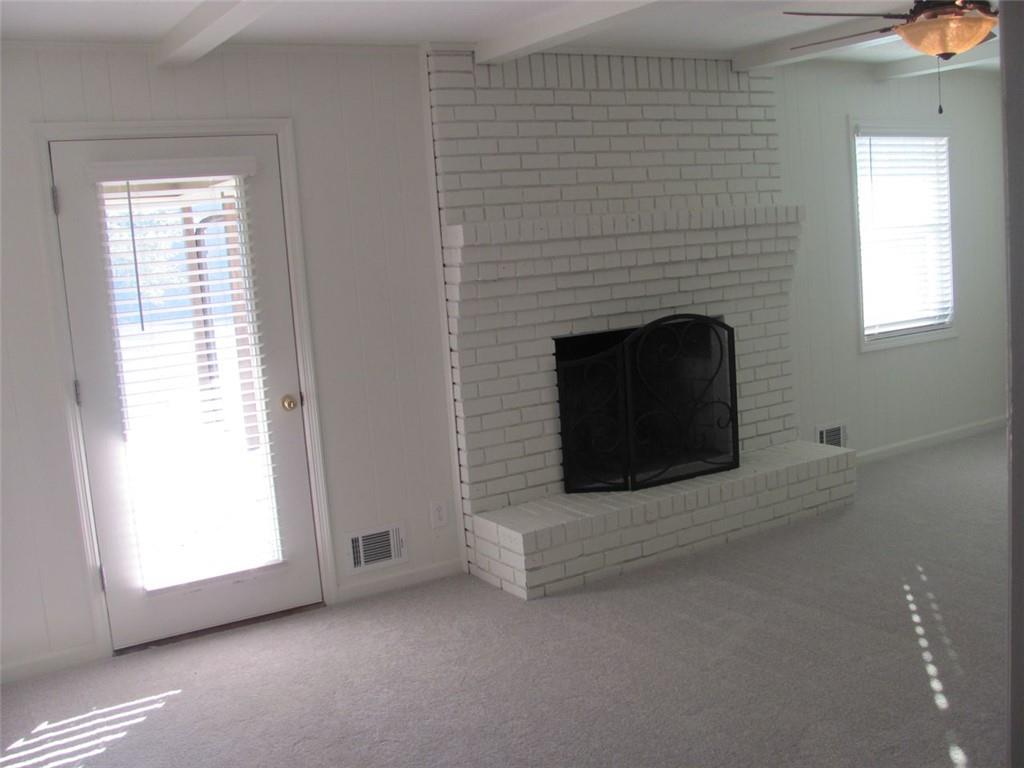 3415 Macland Road Powder Springs, GA 30127 - Photo 10 of 20 a living room with a fireplace and a window