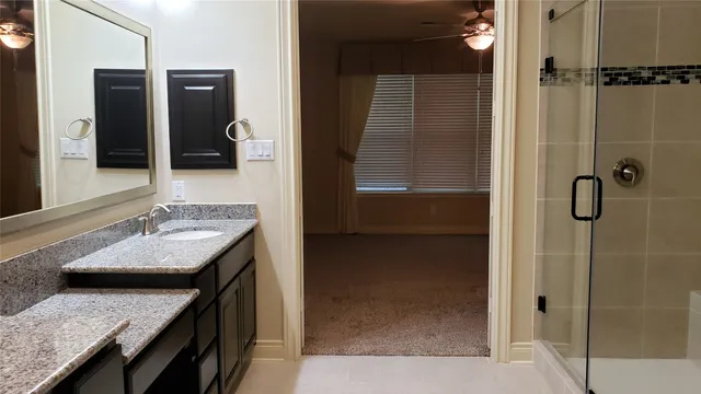 a kitchen with wooden cabinets and a stove top oven