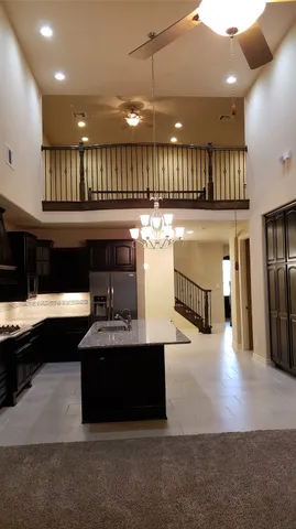 a view of a kitchen and chandelier