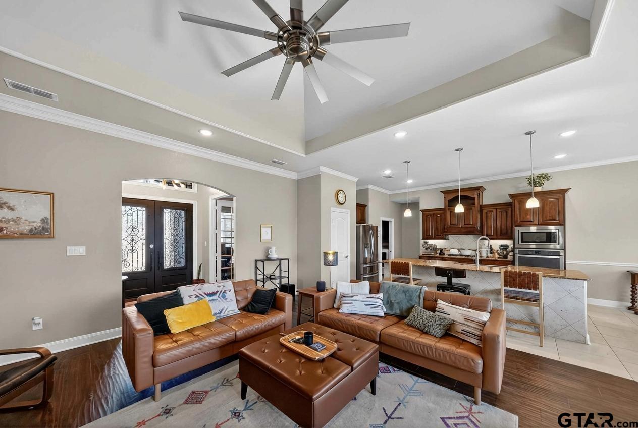 2202 Rana Park Flint, TX 75762 - Photo 13 of 47 a living room with furniture kitchen view and a chandelier