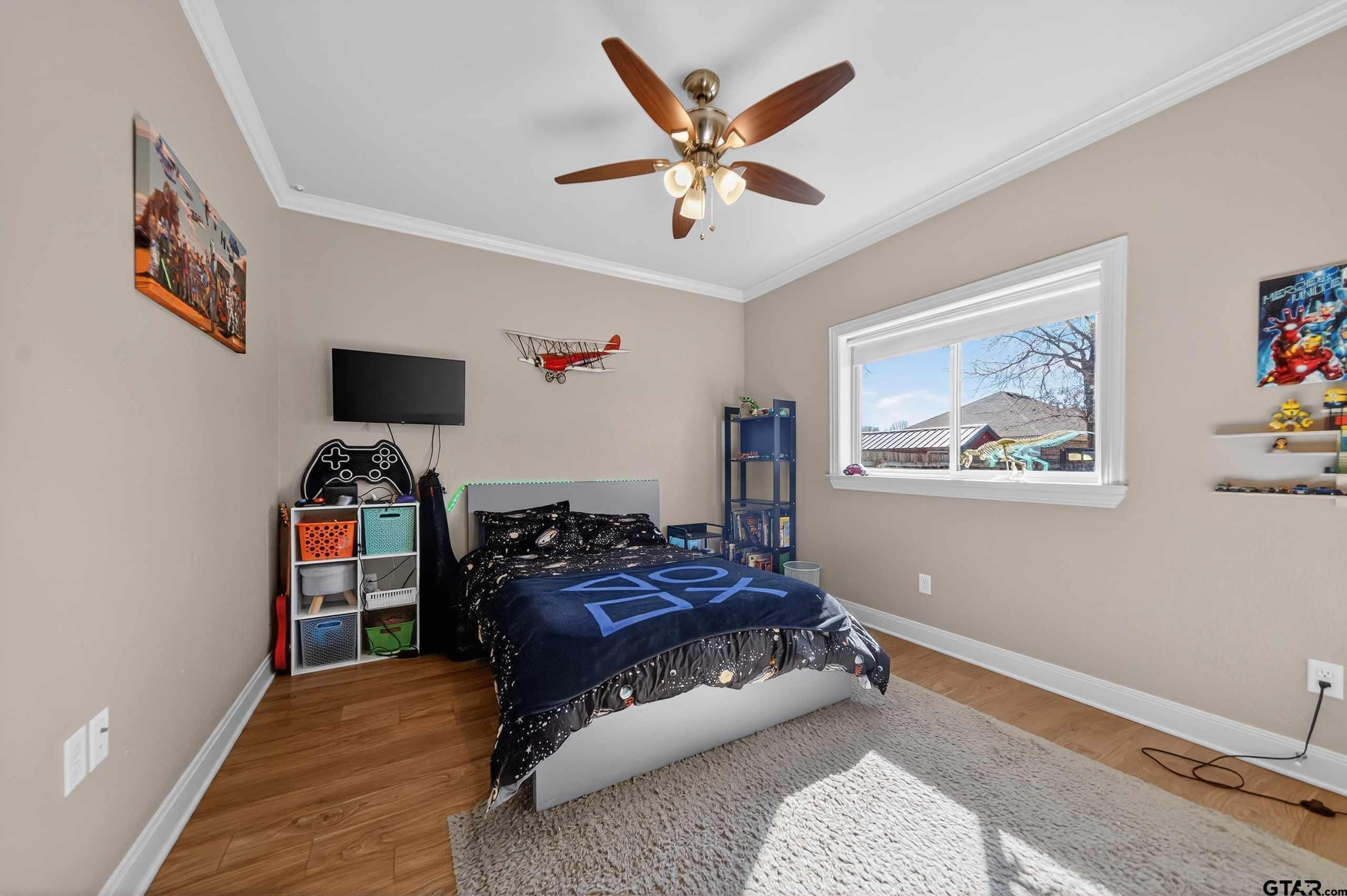 2202 Rana Park Flint, TX 75762 - Photo 19 of 47 a bed room with a bed and a tv