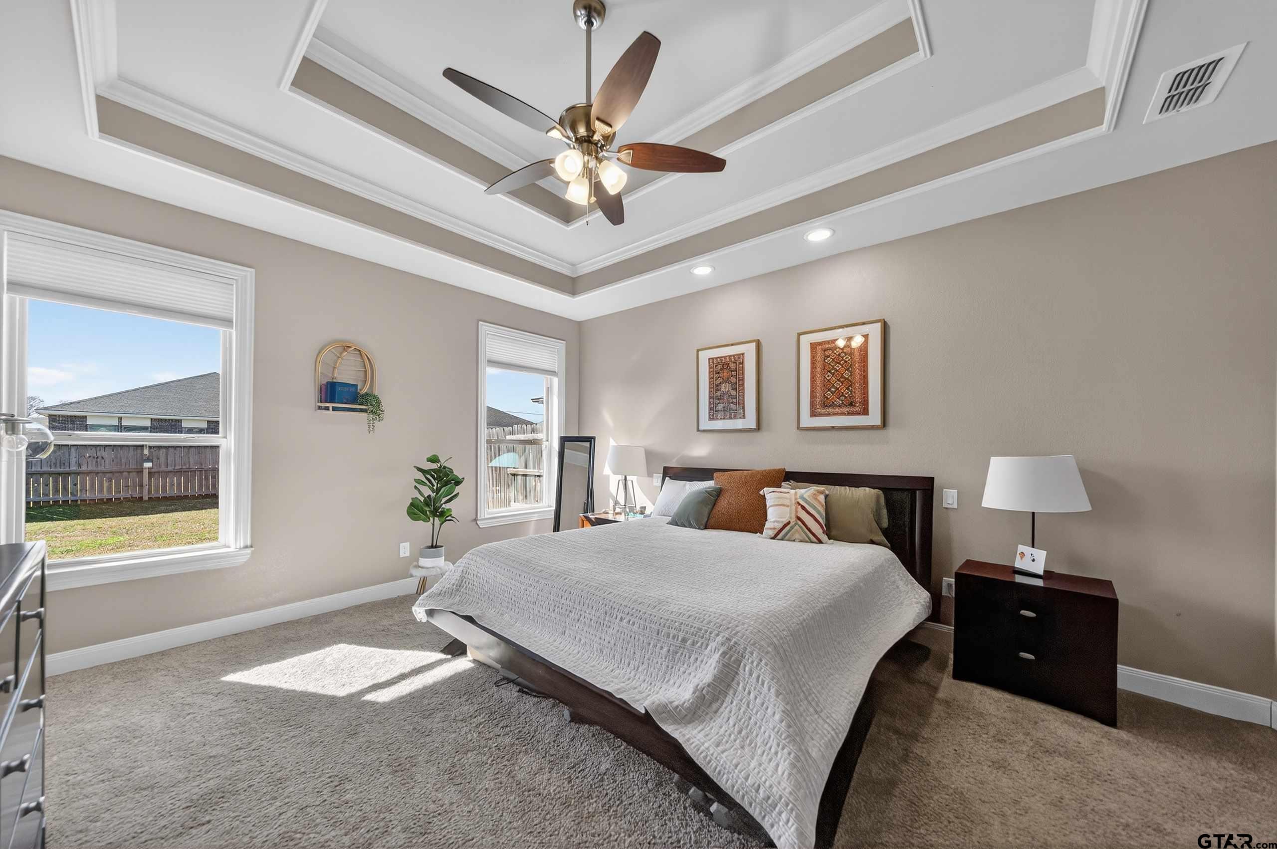 2202 Rana Park Flint, TX 75762 - Photo 27 of 47 a bedroom with a bed and a chandelier