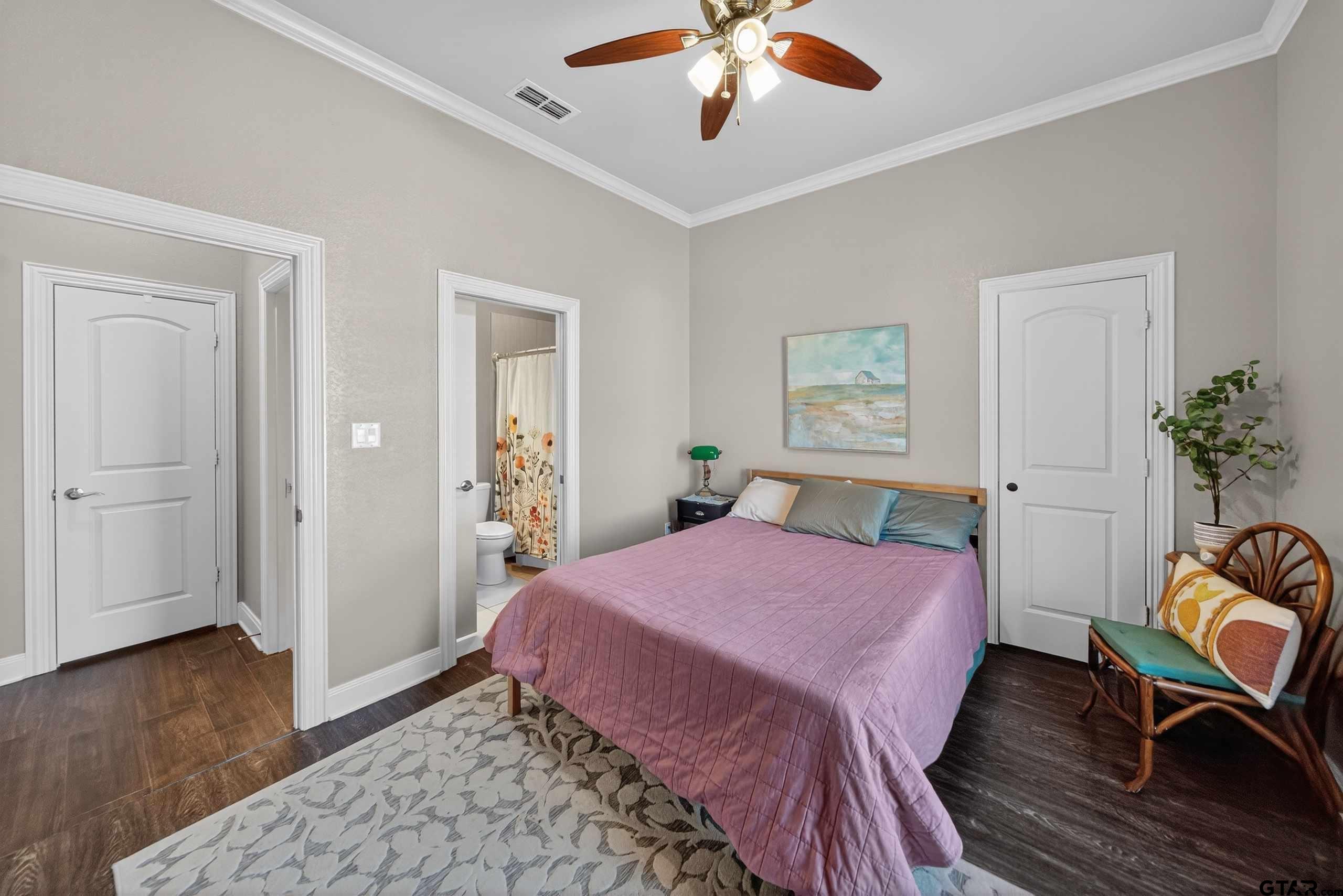 2202 Rana Park Flint, TX 75762 - Photo 37 of 47 a bedroom with a bed dresser and wooden floor