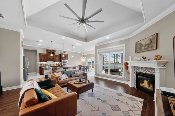 a living room with fireplace furniture and a fireplace