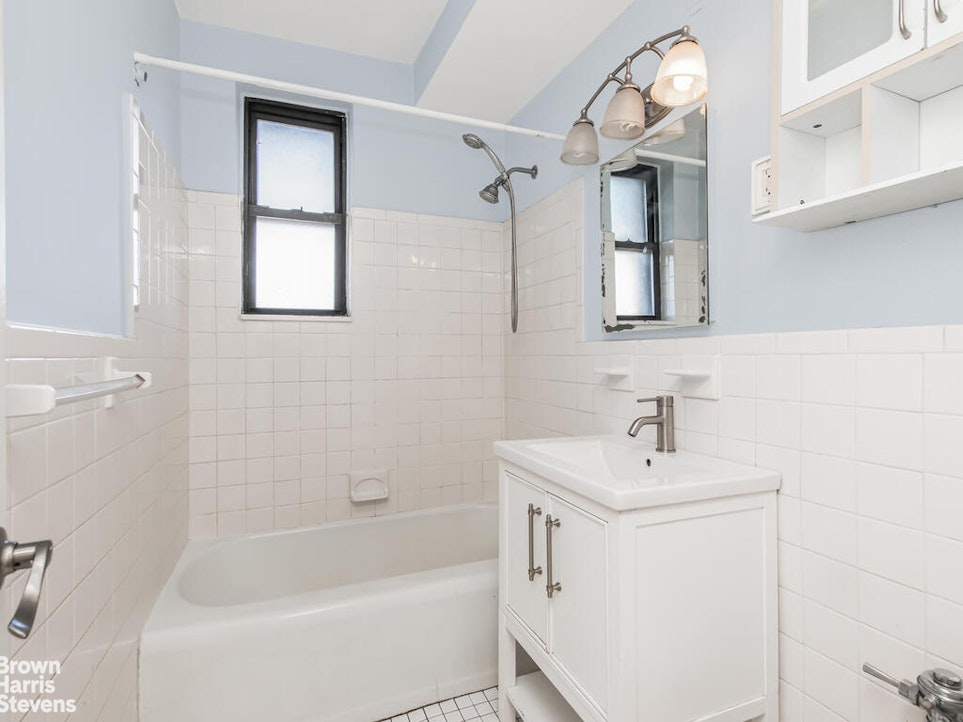 645 West 239th Street, Unit 6C Bronx, NY 10463 - Photo 11 of 18 a bathroom with a sink a toilet and shower