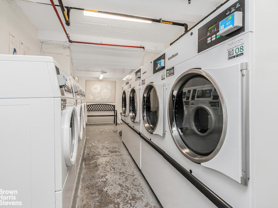 645 West 239th Street, Unit 6C Bronx, NY 10463 - Photo 12 of 18 a utility room with dryer and washer