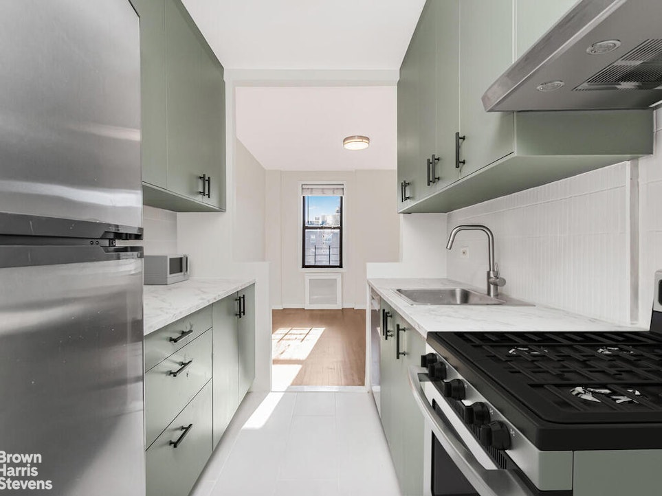 645 West 239th Street, Unit 6C Bronx, NY 10463 - Photo 6 of 18 a kitchen with cabinets and stove