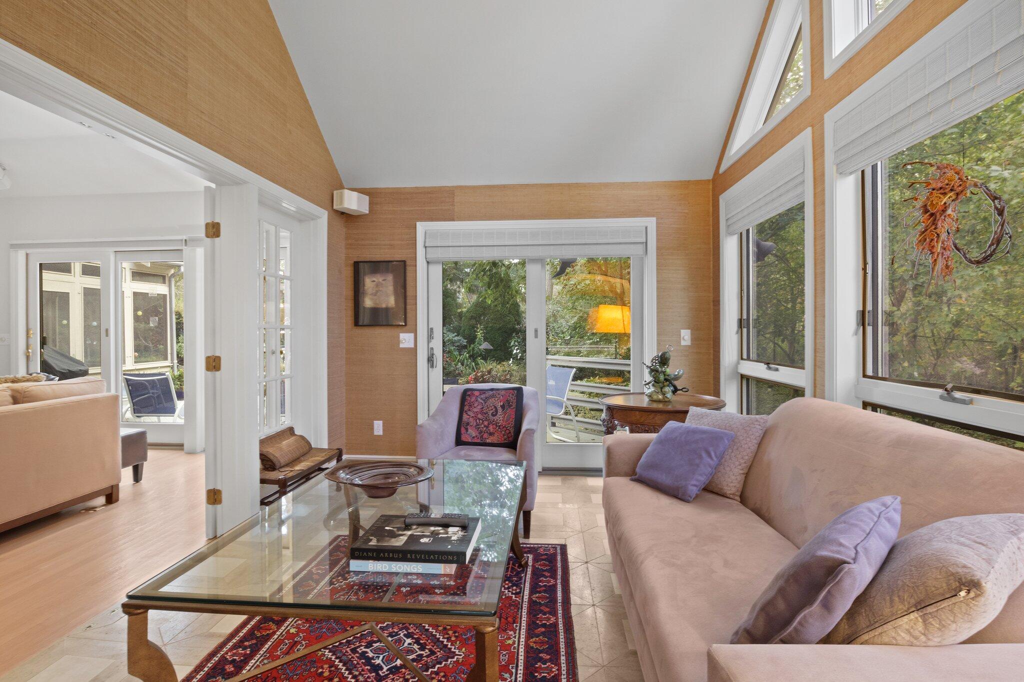 135 Locust Road Eastham, MA 02642 - Photo 17 of 88 a living room with furniture and large windows