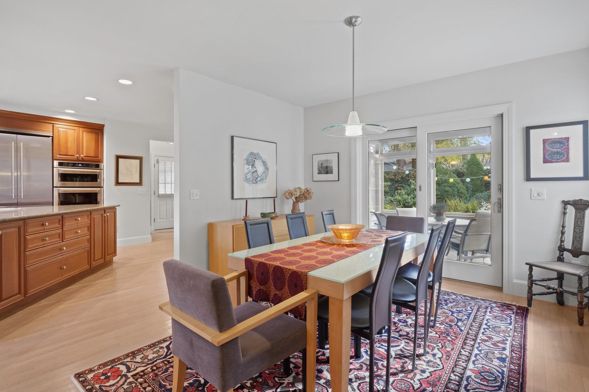 135 Locust Road Eastham, MA 02642 - Photo 20 of 88 a view of a dining room with furniture window and wooden floor