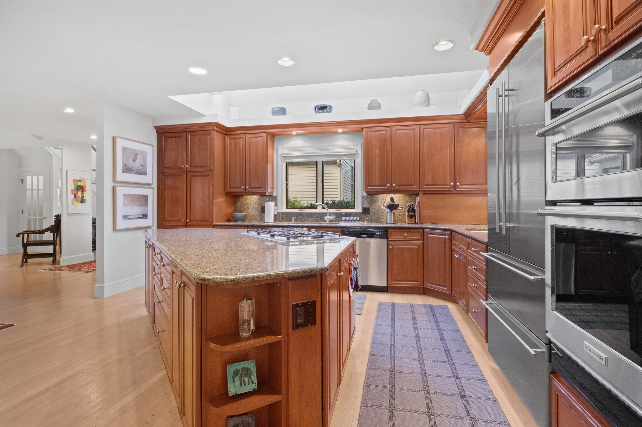 135 Locust Road Eastham, MA 02642 - Photo 23 of 88 a kitchen with granite countertop a sink a counter top space stainless steel appliances and cabinets