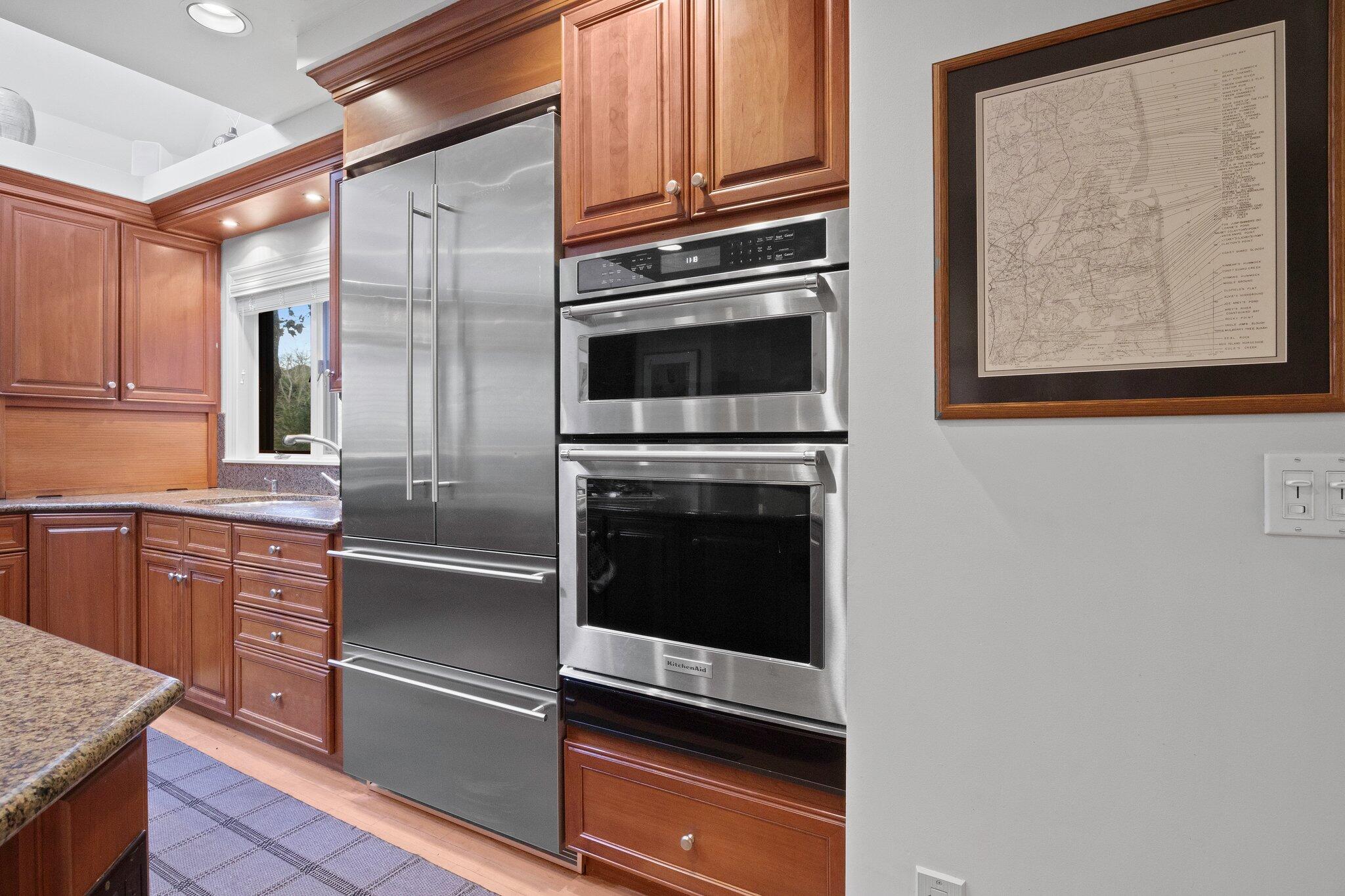 135 Locust Road Eastham, MA 02642 - Photo 24 of 88 a kitchen with granite countertop cabinets stainless steel appliances and a counter space