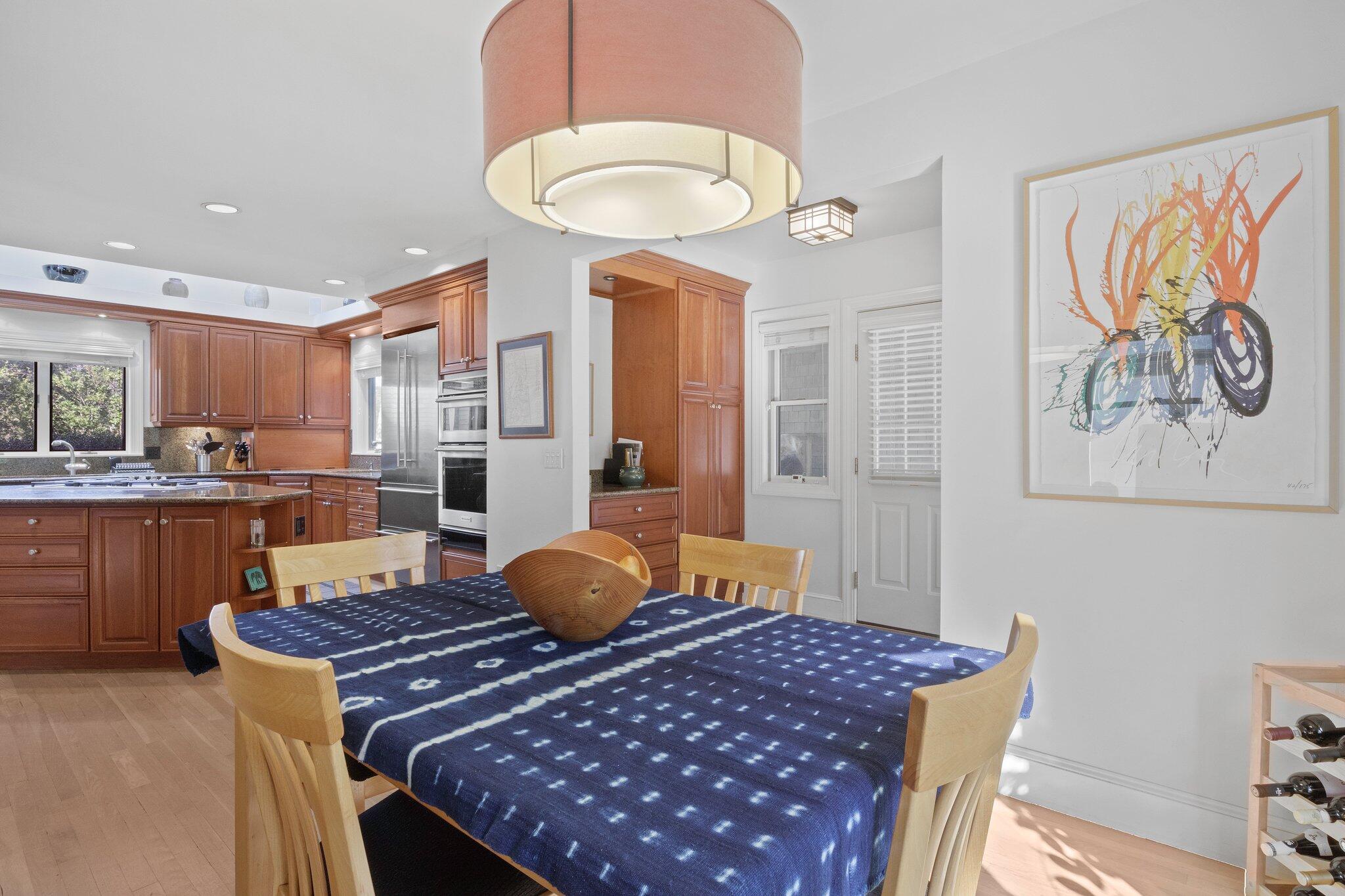 135 Locust Road Eastham, MA 02642 - Photo 28 of 88 a living room with a table and chairs