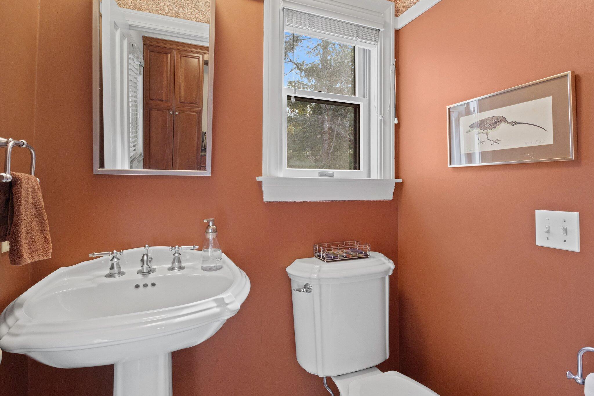 135 Locust Road Eastham, MA 02642 - Photo 30 of 88 a bathroom with a sink a toilet and mirror