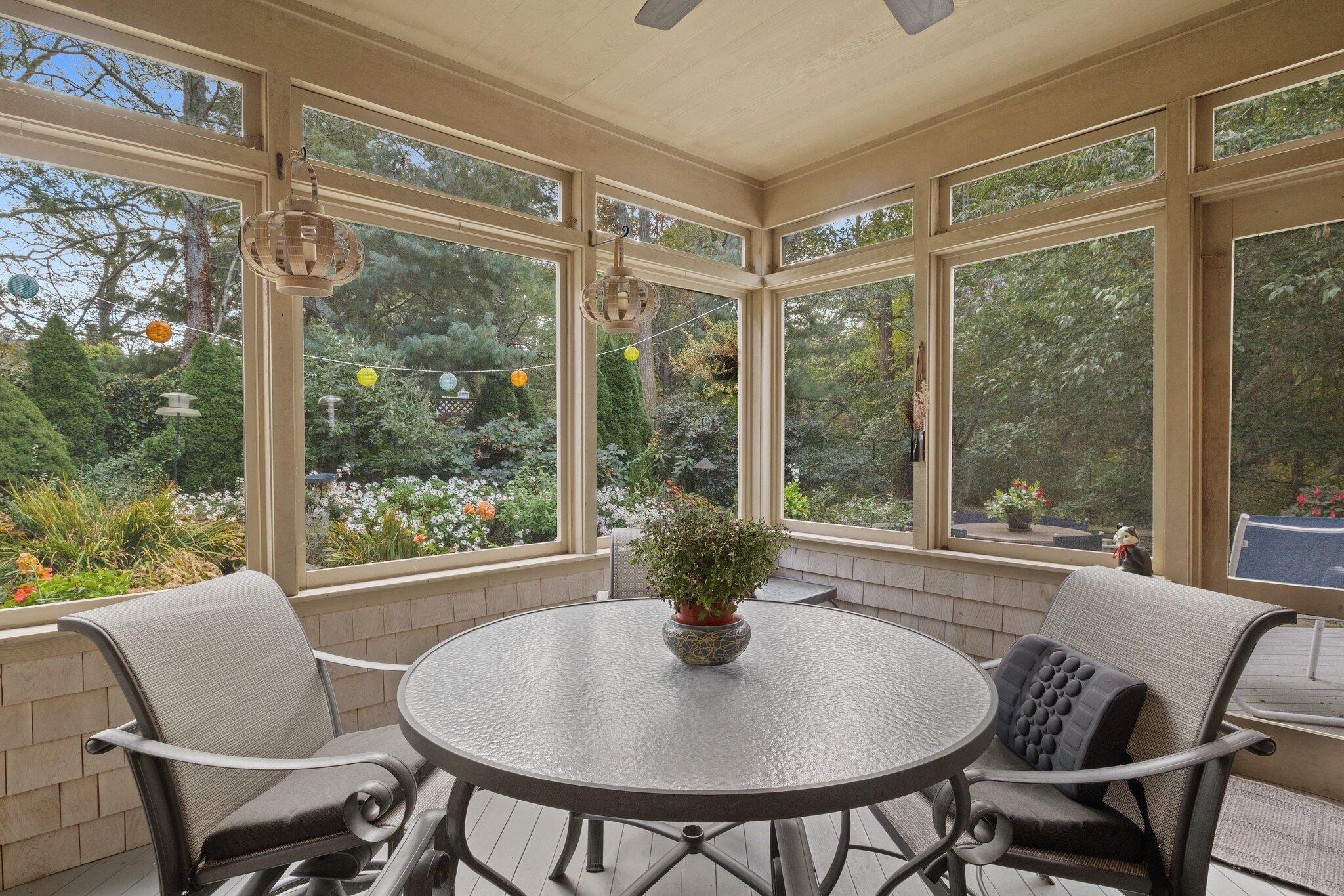 135 Locust Road Eastham, MA 02642 - Photo 32 of 88 a dining room with furniture window and outside view