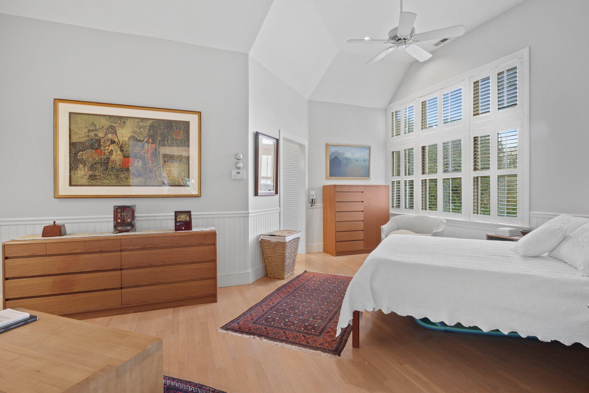 135 Locust Road Eastham, MA 02642 - Photo 34 of 88 a bedroom with a bed wooden floor and window