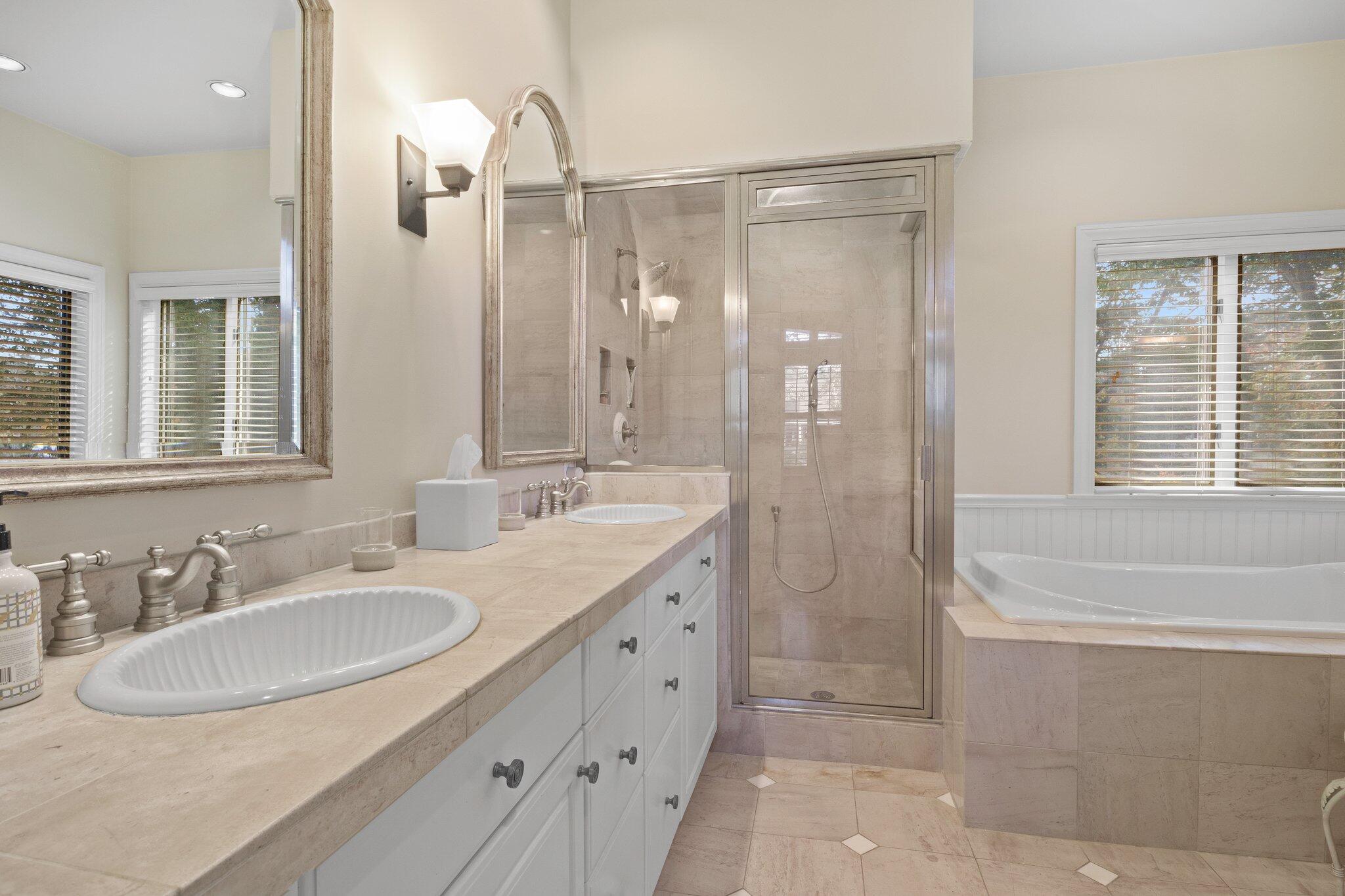 135 Locust Road Eastham, MA 02642 - Photo 39 of 88 a bathroom with a granite countertop sink a large mirror and a bathtub