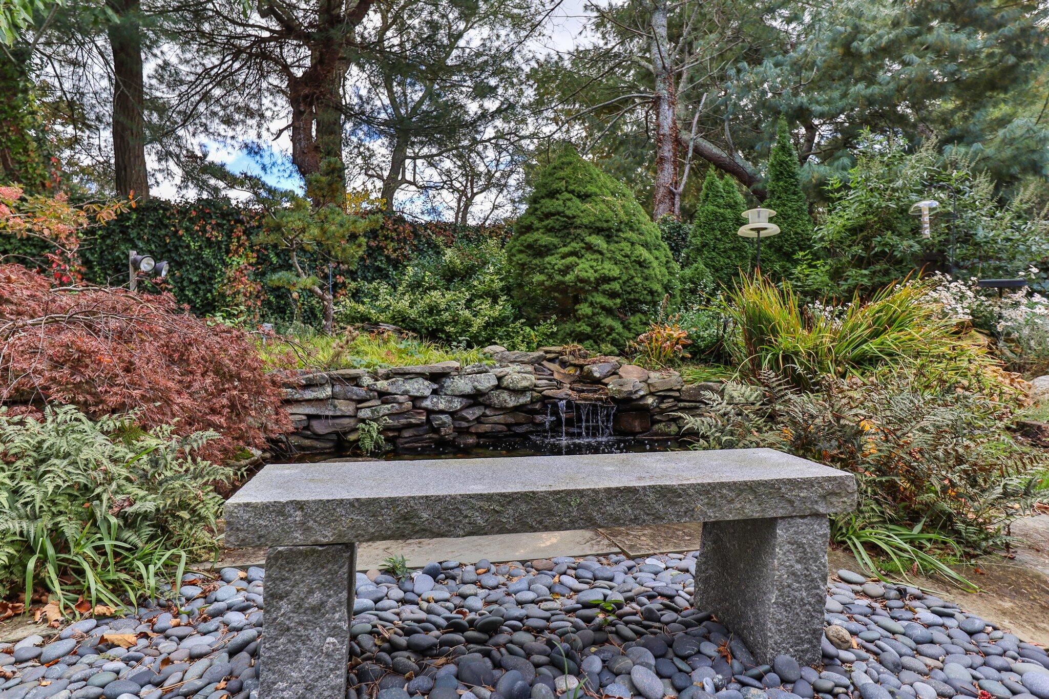 135 Locust Road Eastham, MA 02642 - Photo 70 of 88 a view of a yard with plants and trees