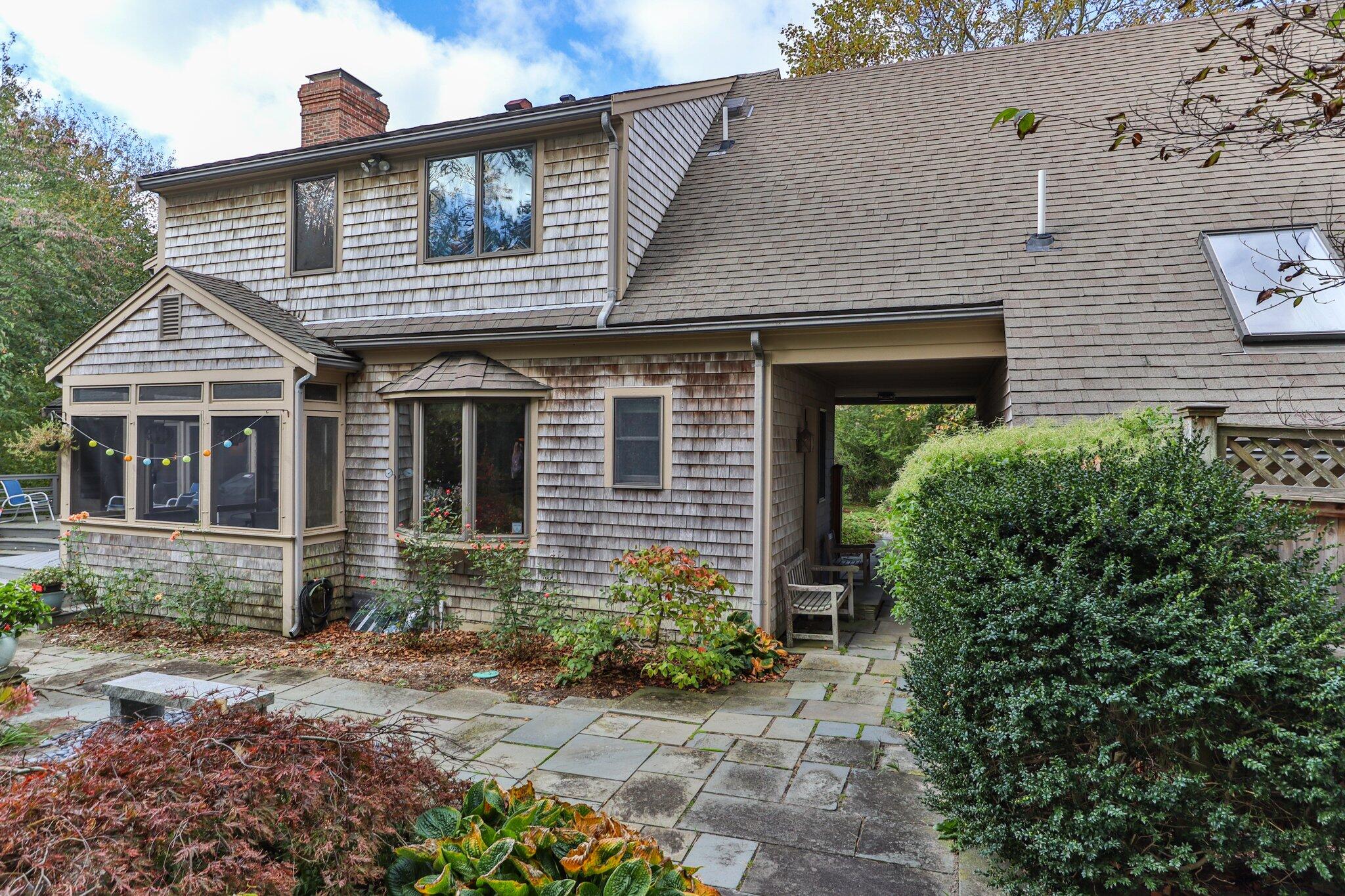 135 Locust Road Eastham, MA 02642 - Photo 74 of 88 a front view of a house with garden