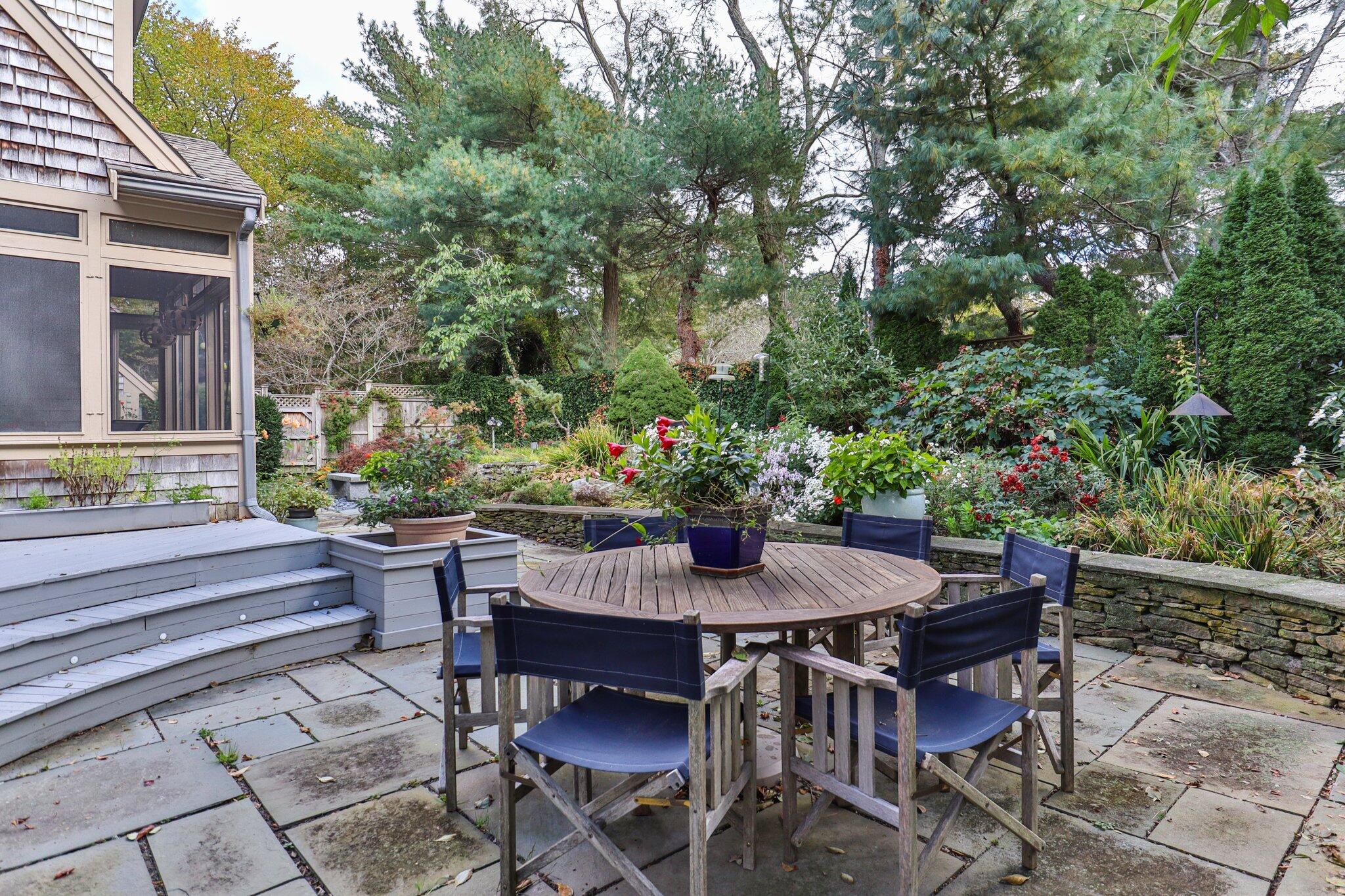 135 Locust Road Eastham, MA 02642 - Photo 77 of 88 a view of patio with a table and chairs