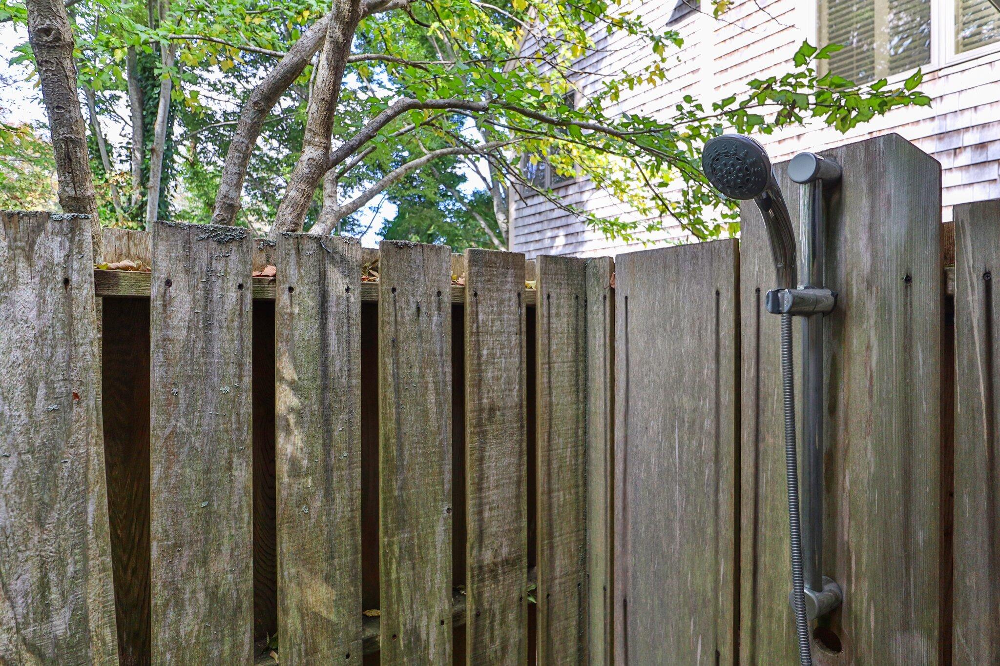 135 Locust Road Eastham, MA 02642 - Photo 83 of 88 a view of a wooden fence next to a large tree
