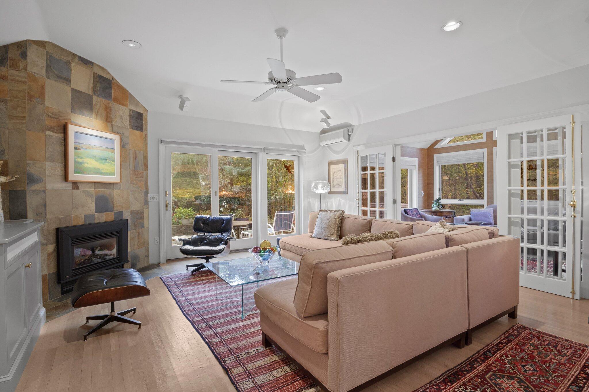 135 Locust Road Eastham, MA 02642 - Photo 6 of 88 a living room with furniture fireplace and a flat screen tv