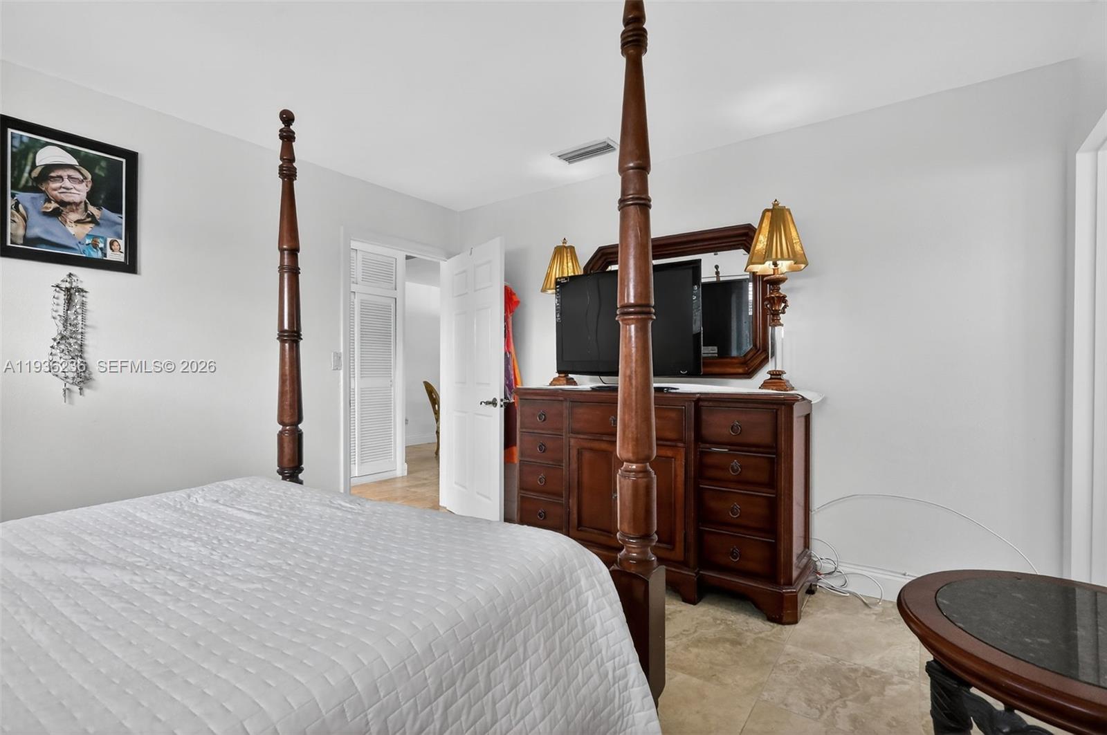 17841 Northwest 84th Court Hialeah, FL 33015 - Photo 12 of 76 a bedroom with a bed and furniture