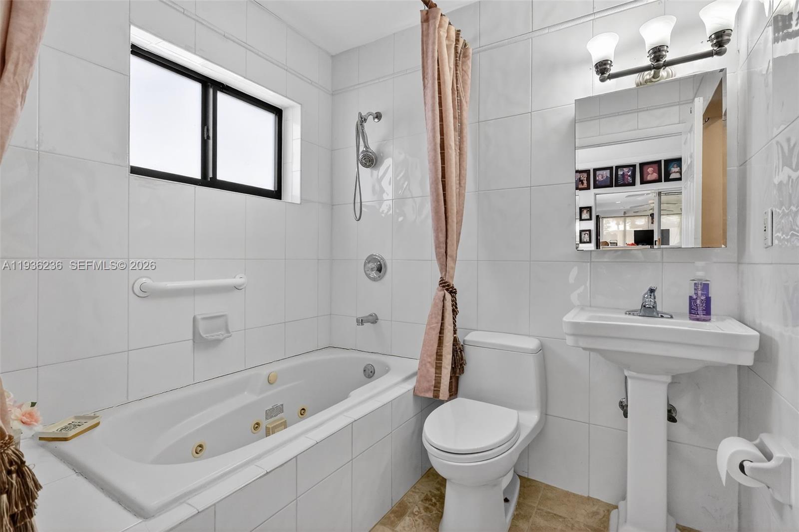 17841 Northwest 84th Court Hialeah, FL 33015 - Photo 18 of 76 a bathroom with a sink toilet and shower