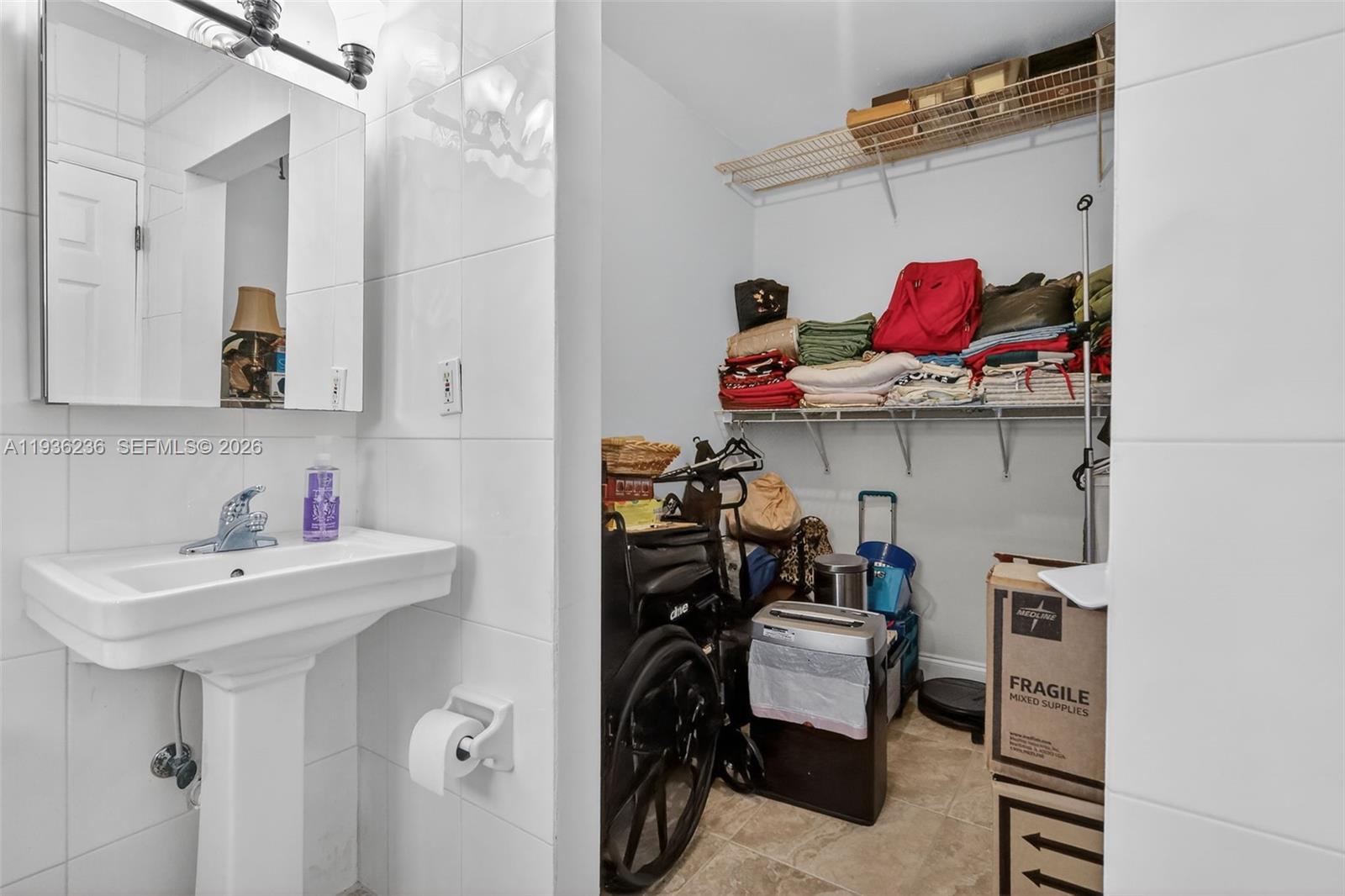 17841 Northwest 84th Court Hialeah, FL 33015 - Photo 19 of 76 a bathroom with a sink and a mirror