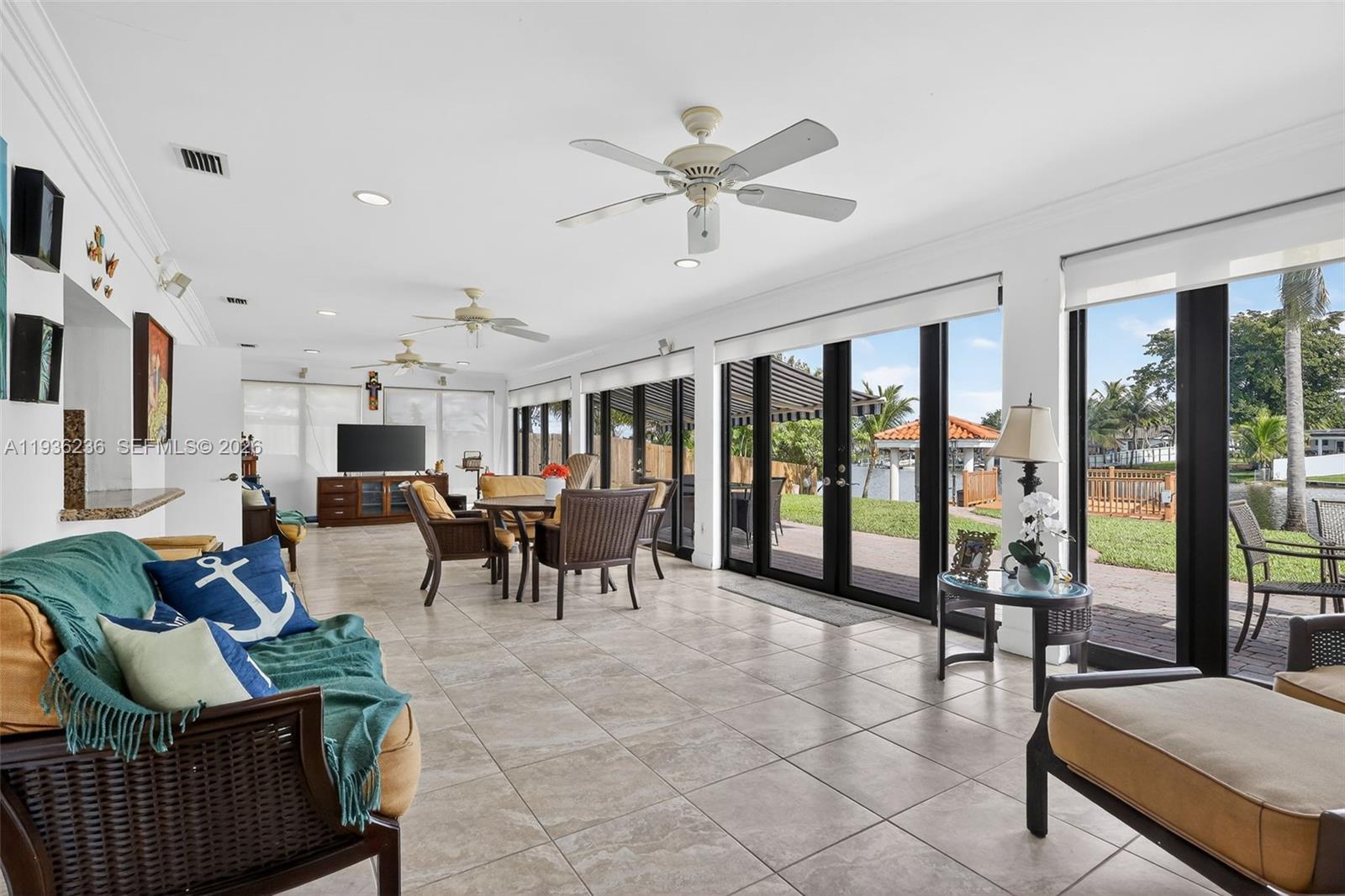 17841 Northwest 84th Court Hialeah, FL 33015 - Photo 21 of 76 a living room with furniture and a large window