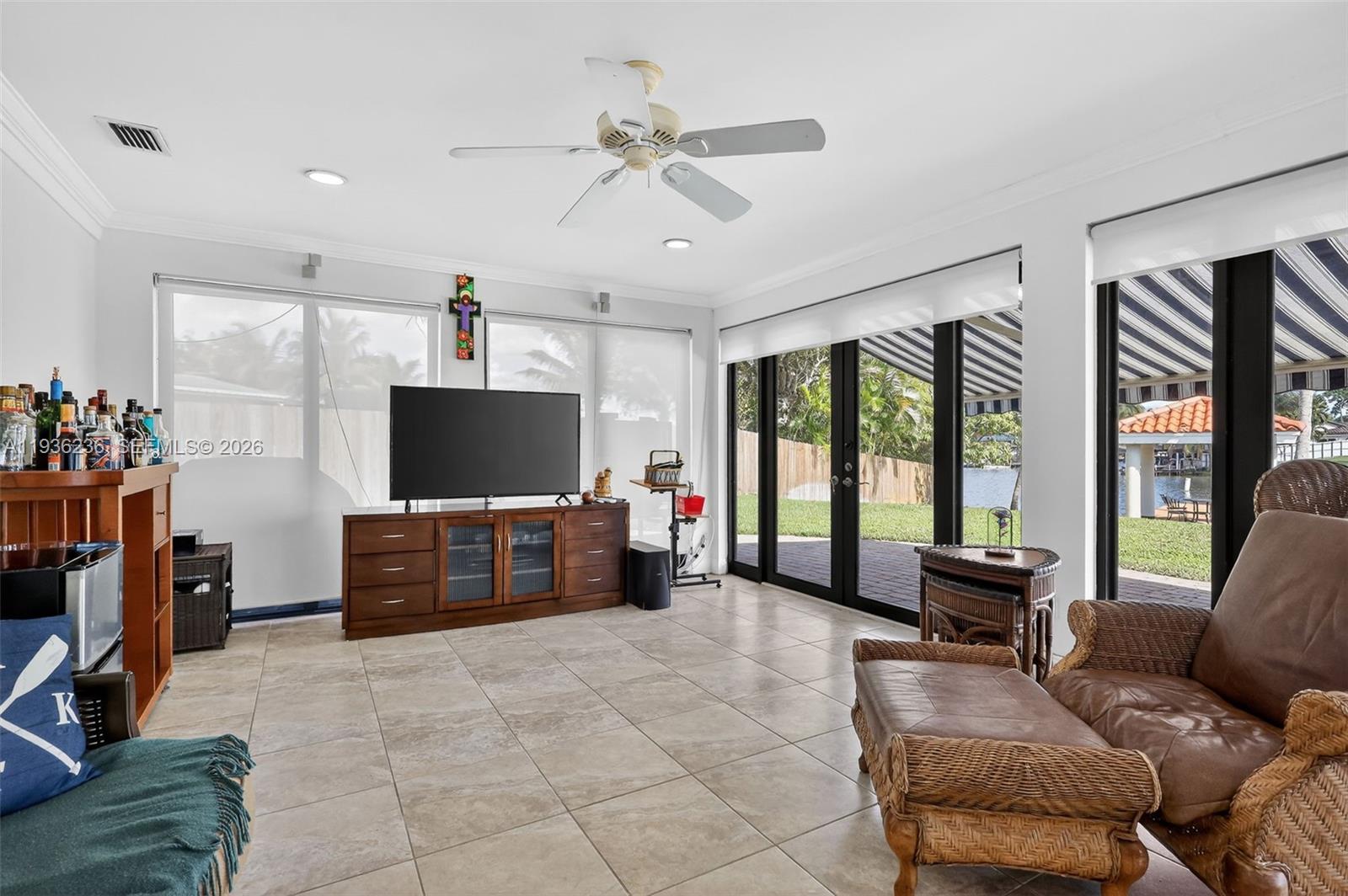 17841 Northwest 84th Court Hialeah, FL 33015 - Photo 23 of 76 a living room with furniture and a flat screen tv