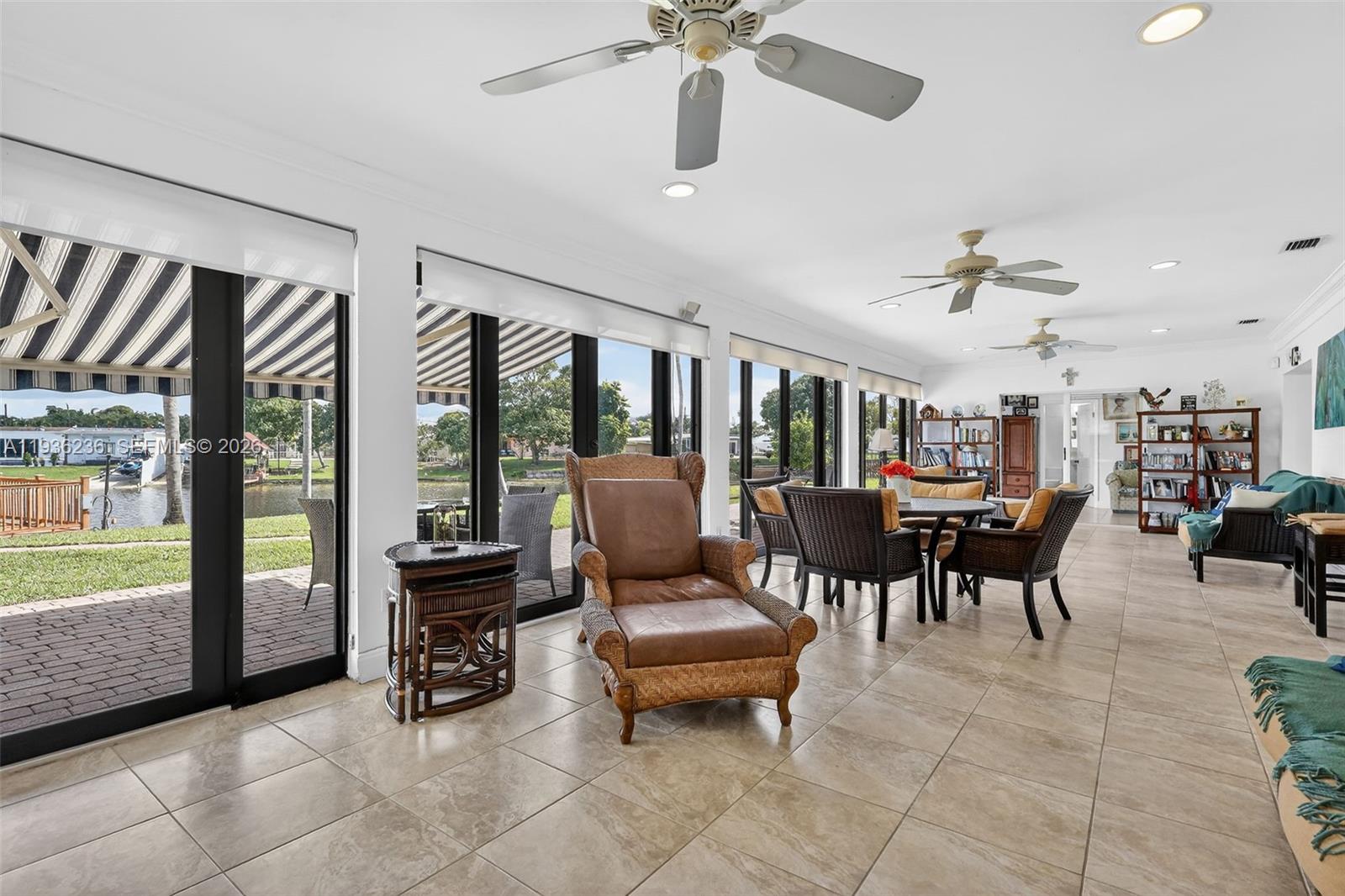 17841 Northwest 84th Court Hialeah, FL 33015 - Photo 25 of 76 a living room with furniture and a large window