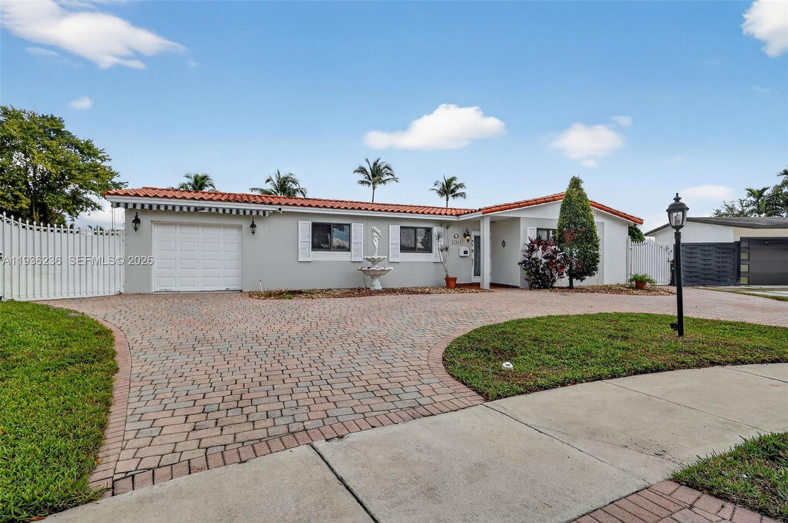 17841 Northwest 84th Court Hialeah, FL 33015 - Photo 3 of 76 a view of a house with a patio