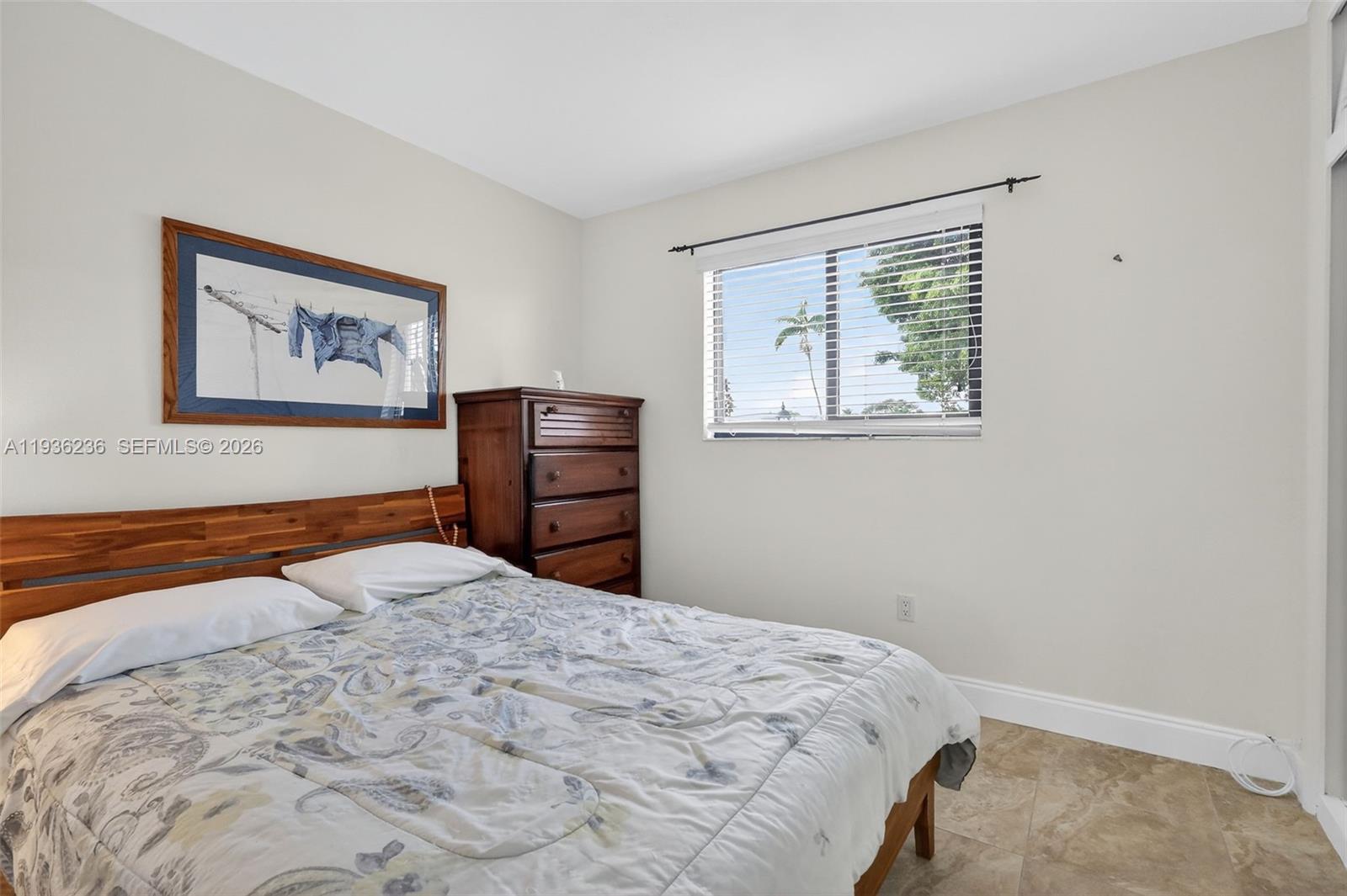 17841 Northwest 84th Court Hialeah, FL 33015 - Photo 33 of 76 a bedroom with a bed and a window