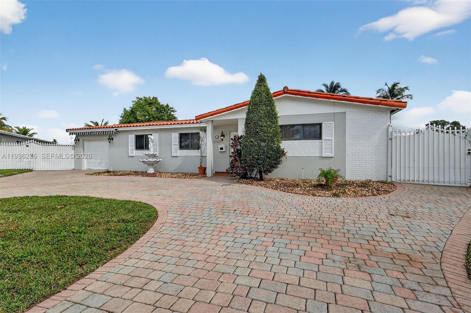 17841 Northwest 84th Court Hialeah, FL 33015 - Photo 4 of 76 a view of house with yard and outdoor space