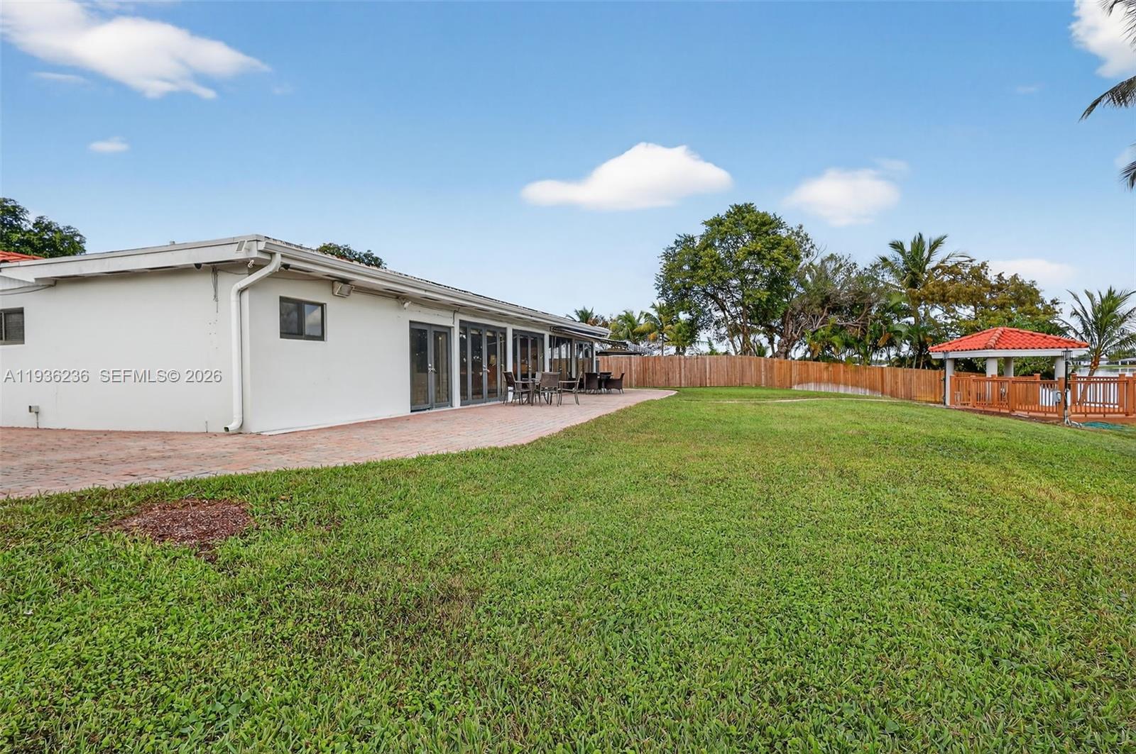 17841 Northwest 84th Court Hialeah, FL 33015 - Photo 49 of 76 a view of a house with a backyard and a garden