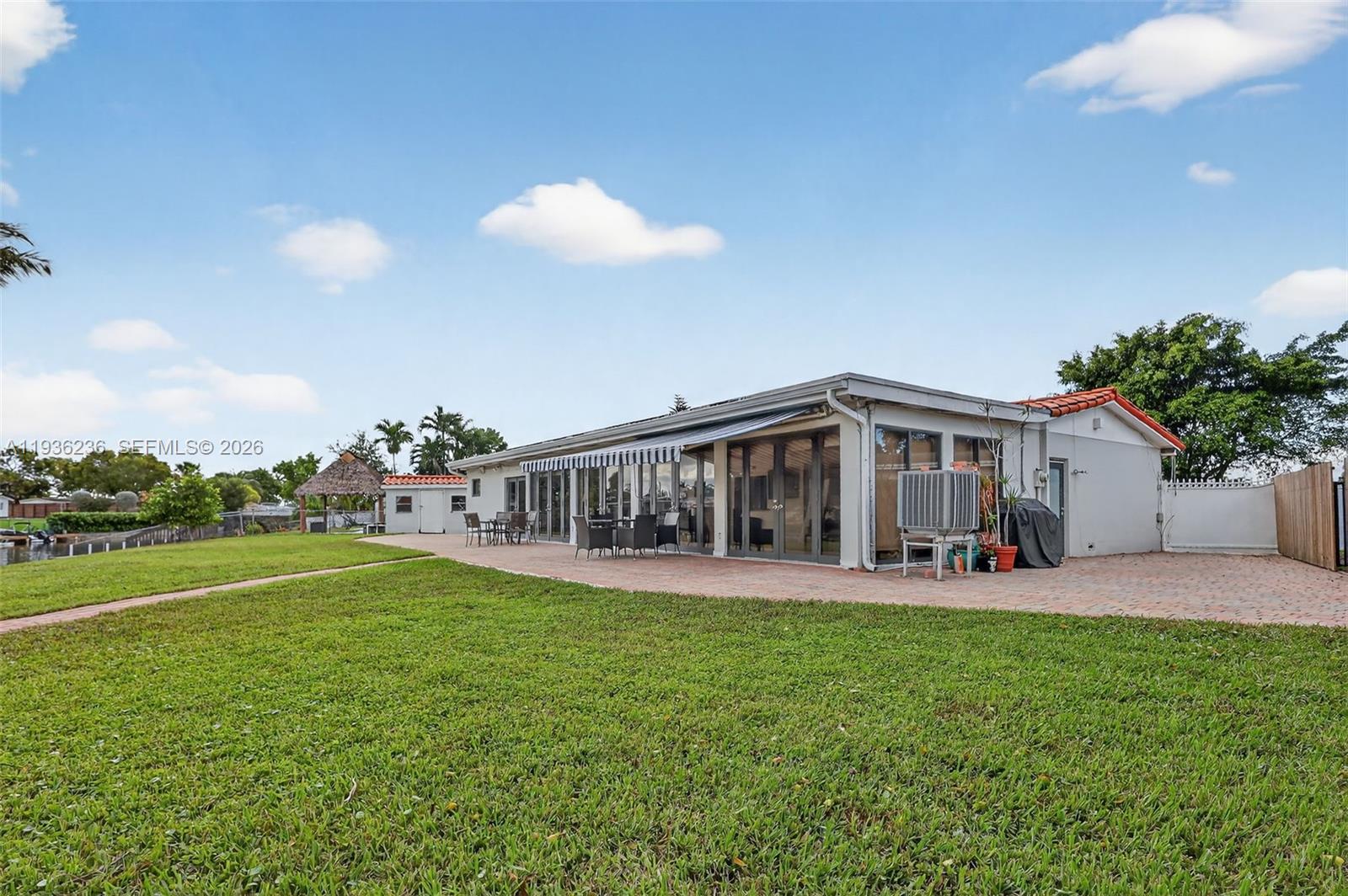 17841 Northwest 84th Court Hialeah, FL 33015 - Photo 53 of 76 a view of a house with a yard and sitting area