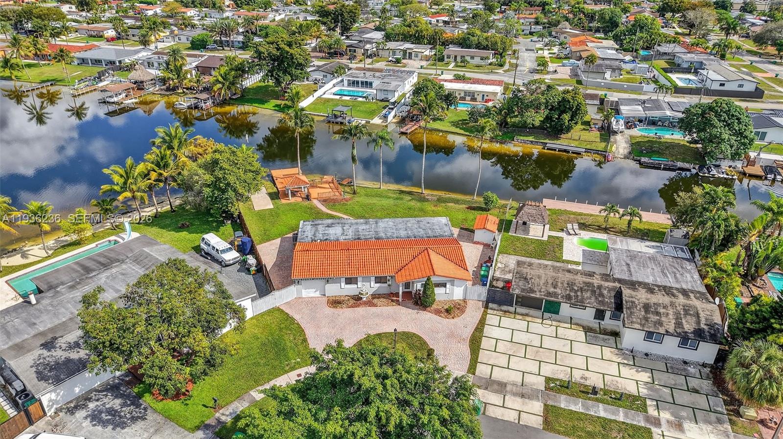 17841 Northwest 84th Court Hialeah, FL 33015 - Photo 65 of 76 an aerial view of a swimming pool with outdoor seating