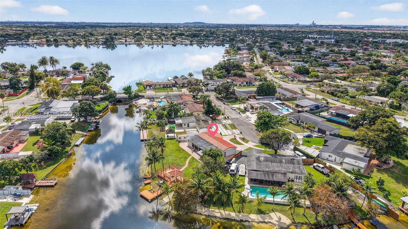 17841 Northwest 84th Court Hialeah, FL 33015 - Photo 70 of 76 an aerial view of a houses with a lake