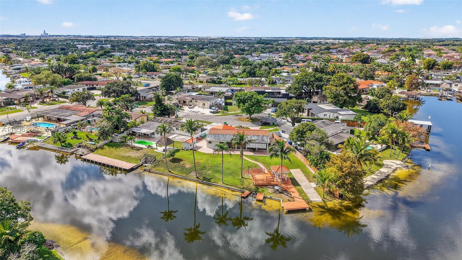 17841 Northwest 84th Court Hialeah, FL 33015 - Photo 74 of 76 an aerial view of residential houses with outdoor space and trees