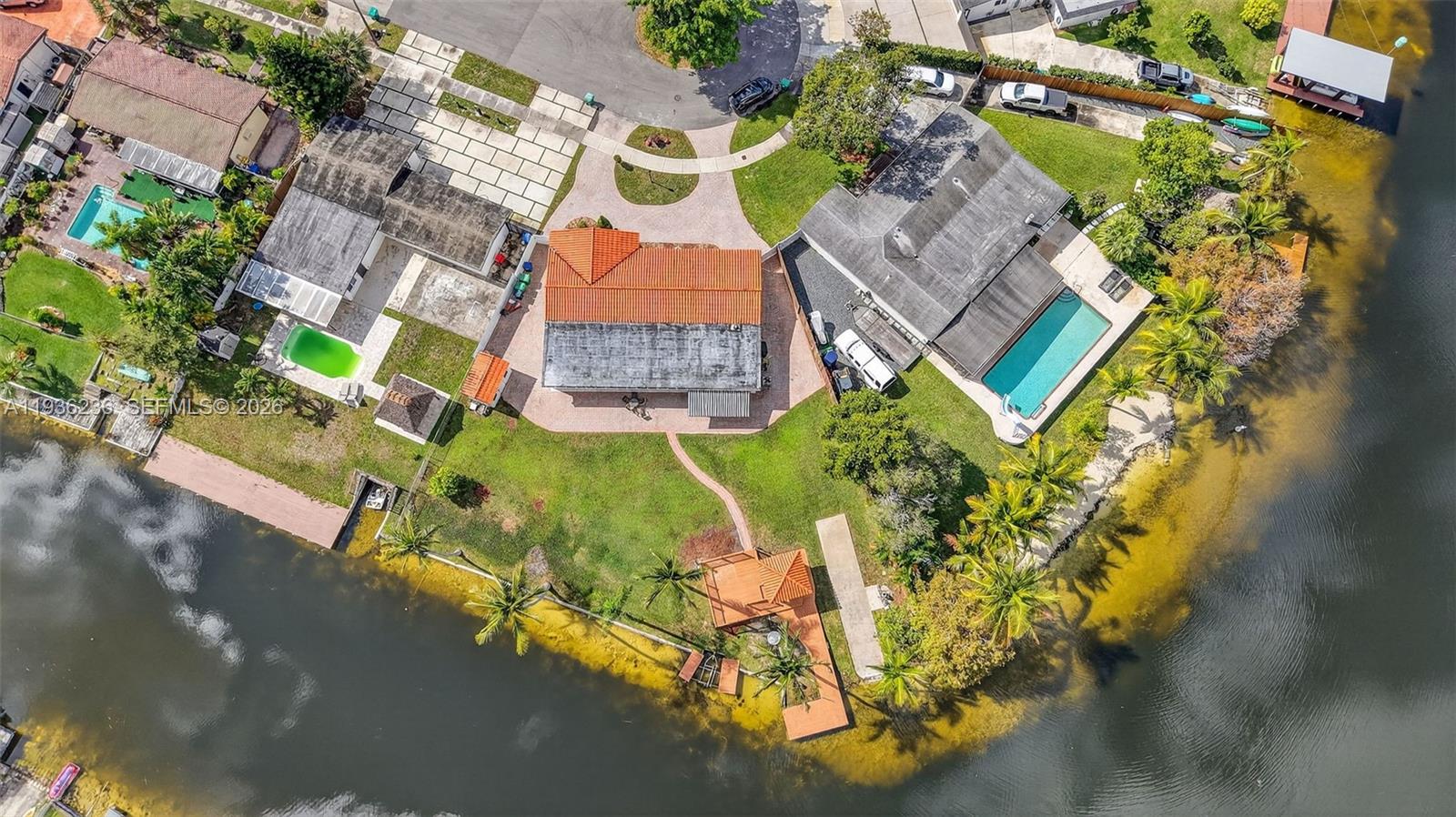 17841 Northwest 84th Court Hialeah, FL 33015 - Photo 76 of 76 an aerial view of a house with a yard and garden