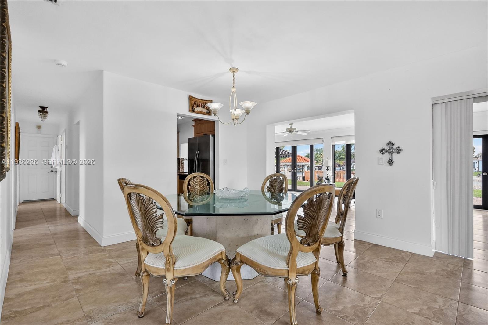 17841 Northwest 84th Court Hialeah, FL 33015 - Photo 8 of 76 a view of a dining room with furniture and chandelier